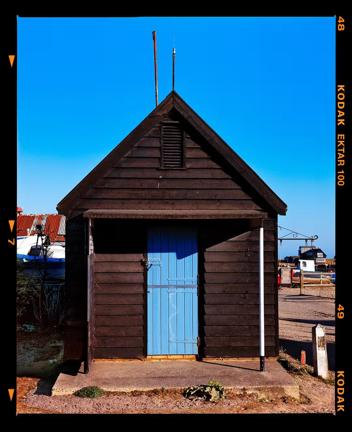 A limited edition photograph by Richard Heeps using vibrant colours, the title is Fishing Hut, Southwold, Suffolk, 2022