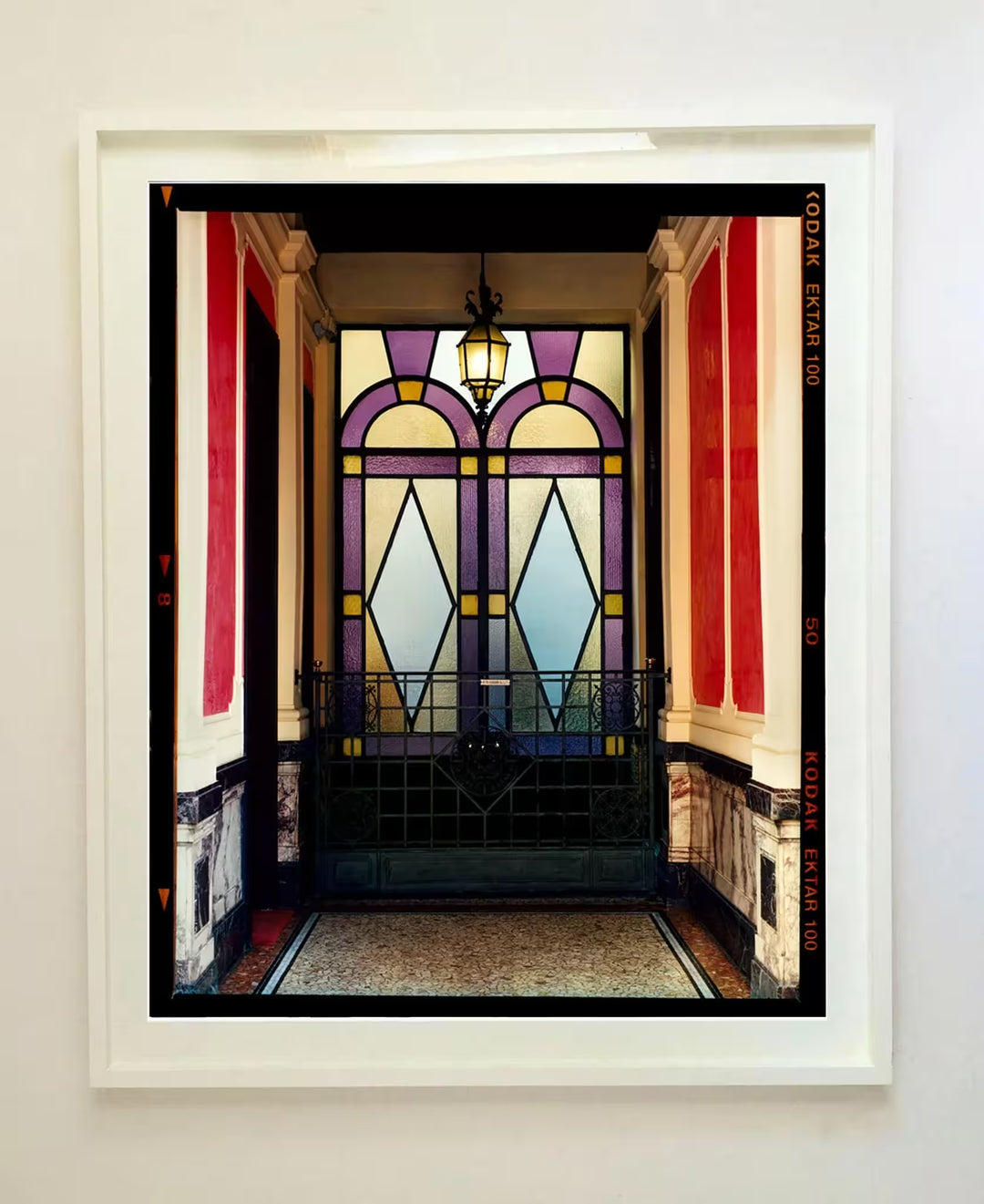 A white framed limited edition photograph by Richard Heeps using vibrant colours, the title is Foyer VII, Milan, 2020