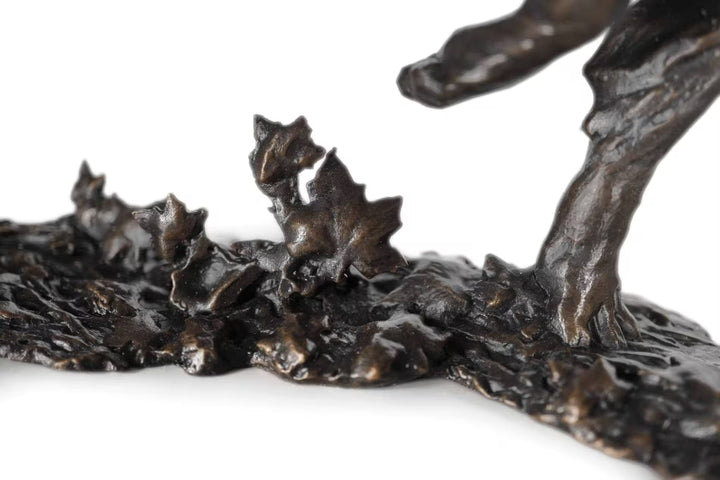 Bronze sculpture of a figure with animals on a white background, Free Spirit by Dean Kendrick