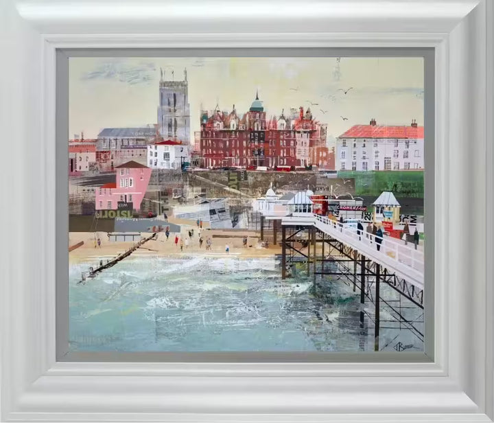 A Tom Butler framed limited edition hand embellished print of Cromer, it shows a collage of Cromer Pier with the surrounding buildings behind, the title is Happy Holidays Cromer