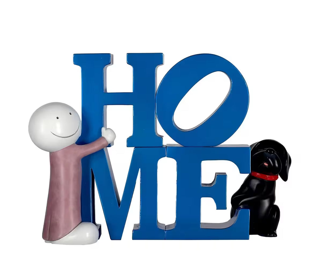 A sculpture by Doug Hyde, on the left a person in purple hugging the word 'Home', on the right is a small black dog with a red collar, the title is Happy at Home