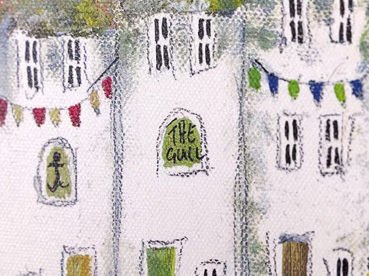 A Rebecca Lardner limited edition of a few houses on a stone cliff behind a beach with boats pulling in and people, the title is Harbour Hideaway II