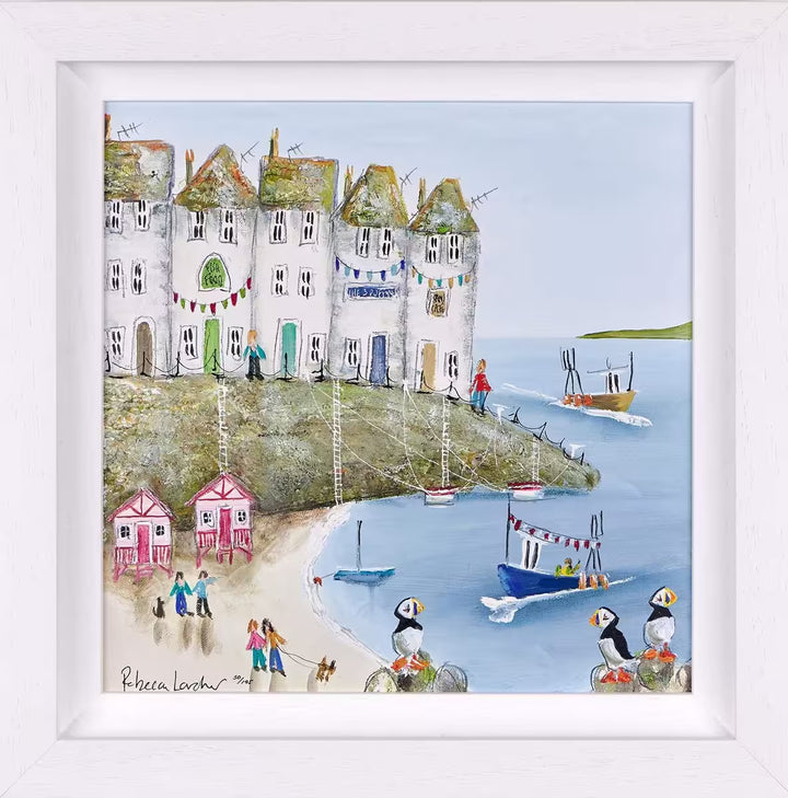 A Rebecca Lardner limited edition of a row of houses behind a beach with pink beach huts and boats pulling in, the title is Harbour Hideaway I