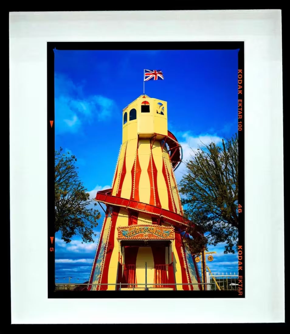 A framed limited edition photograph by Richard Heeps using vibrant colours, the title is Helter Skelter, Great Yarmouth, 2023