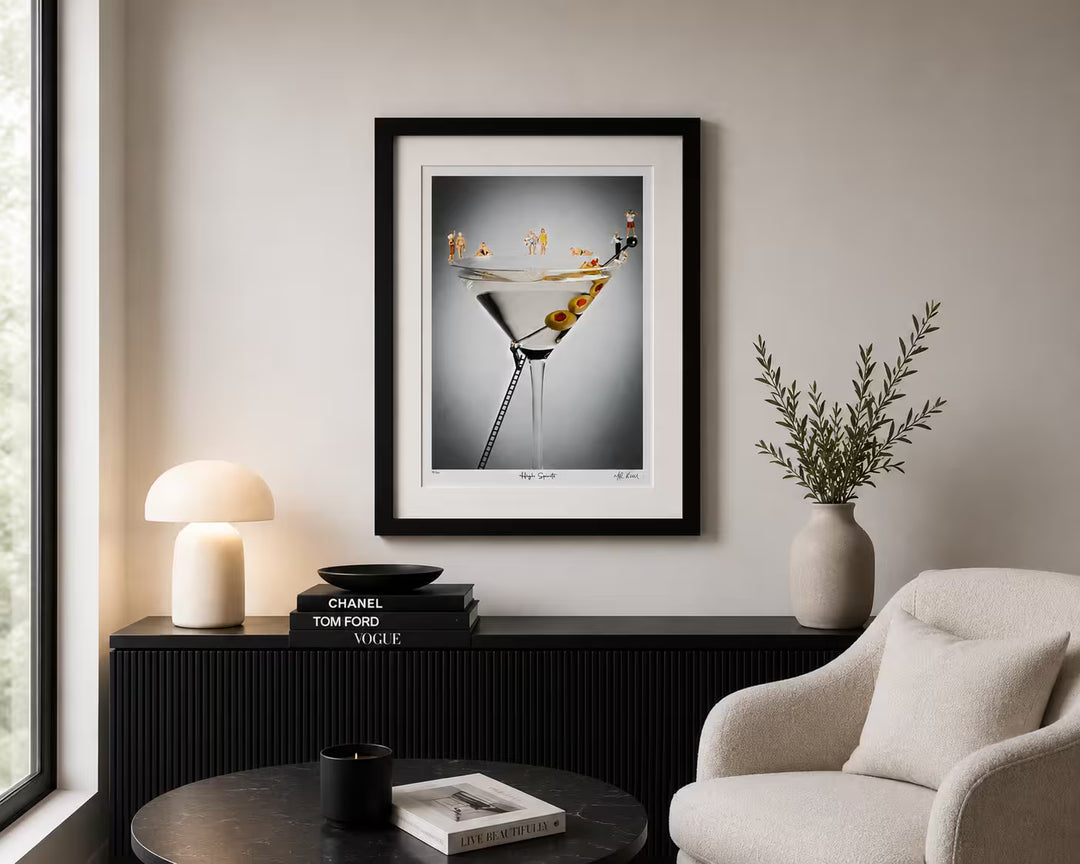 A Mr Kuu limited edition piece of a martini glass with people around it in bathing suits, the title is High Spirits