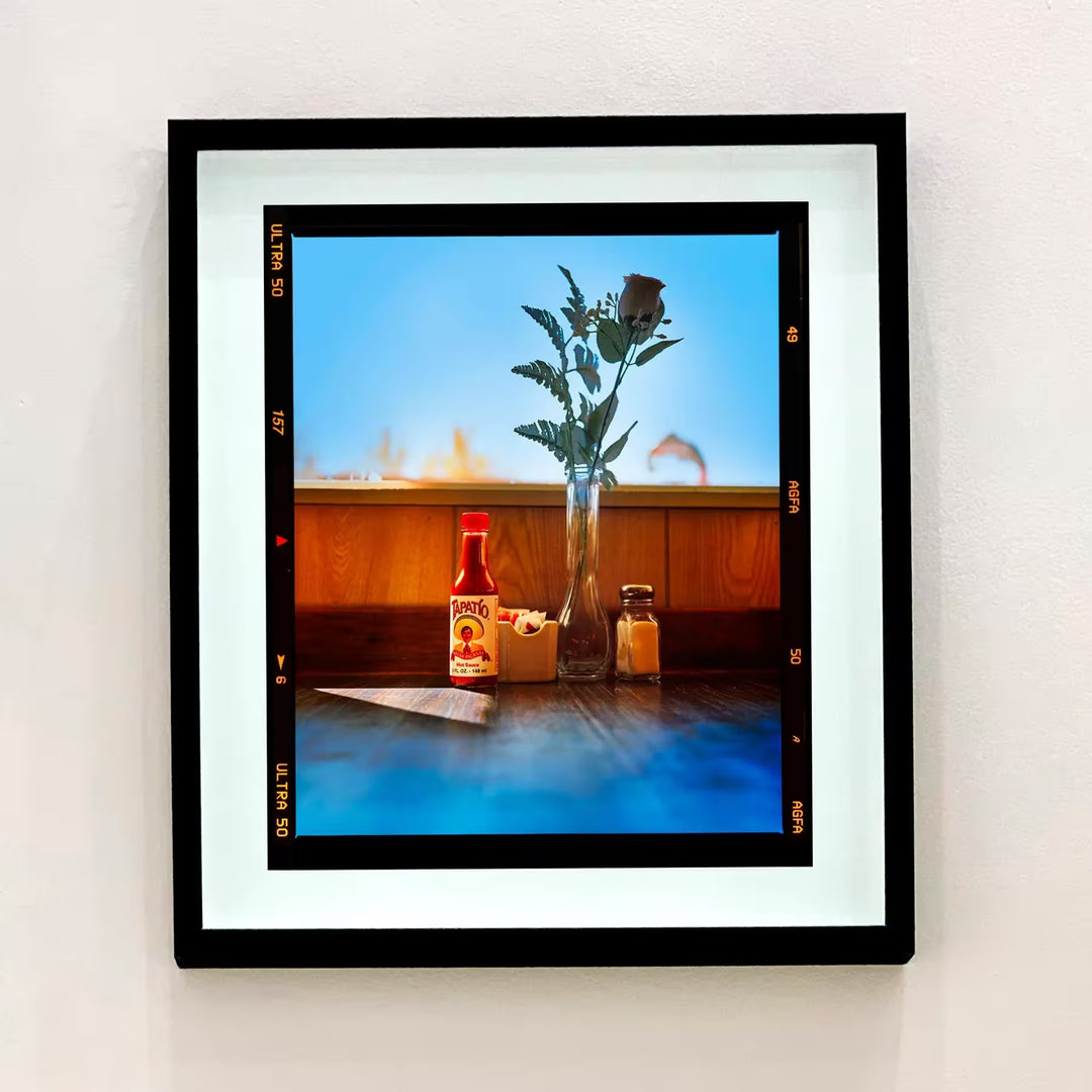 A framed limited edition photograph by Richard Heeps using vibrant colours, the title isHot sauce, Lone Pine, California, 2001