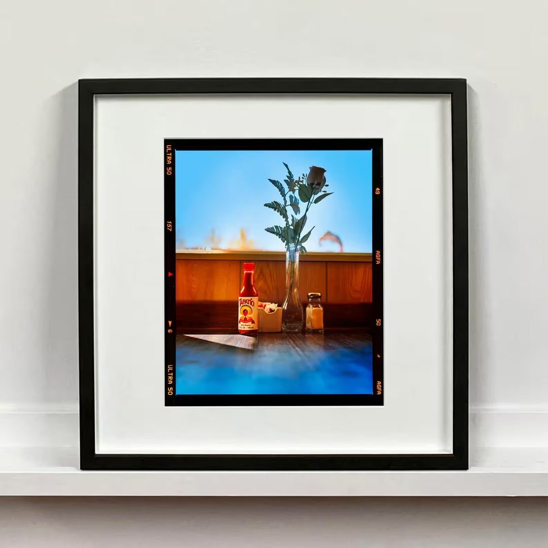A framed limited edition photograph by Richard Heeps using vibrant colours, the title isHot sauce, Lone Pine, California, 2001