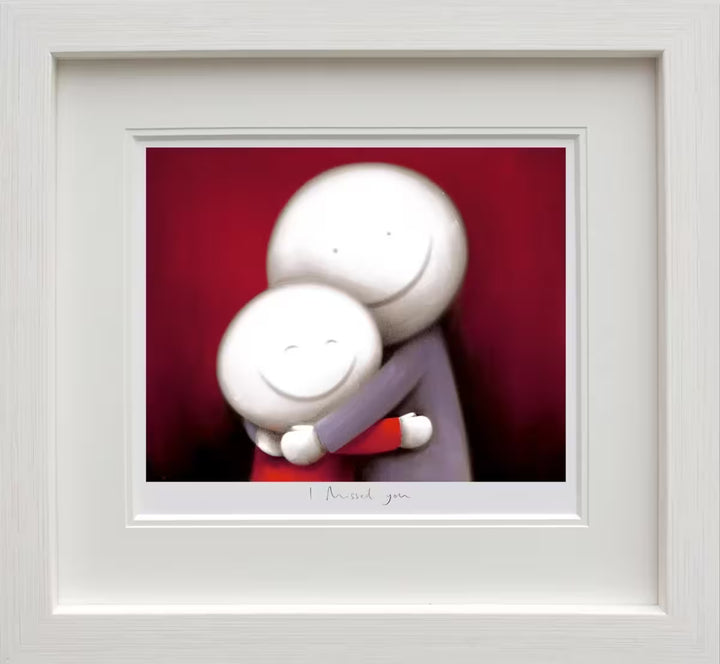A Doug Hyde framed limited edition of a person in purple hugging a smaller person in red, the title is I Missed You