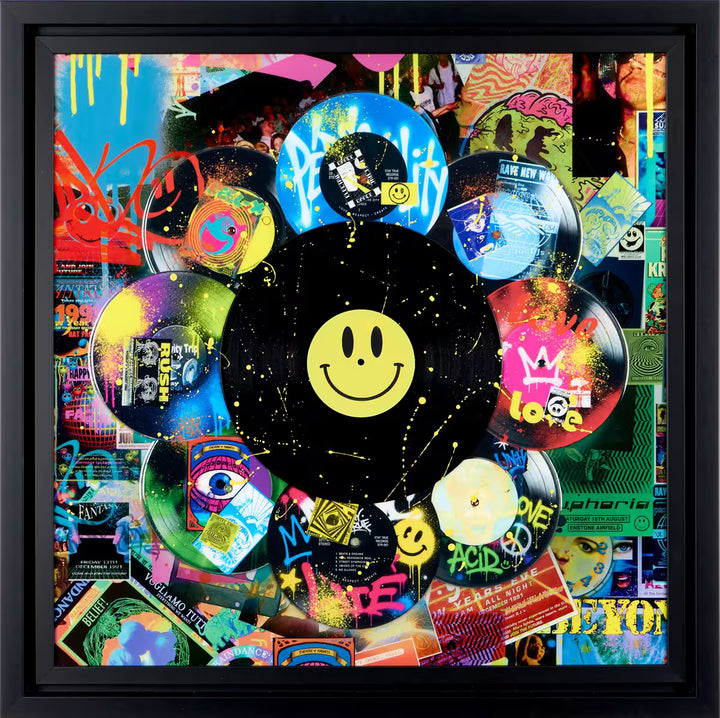 A limited edition mixed media piece by Dan Pearce of lots of differrent vinyl records with spraypaint and designs all over them, the title is In The Mix