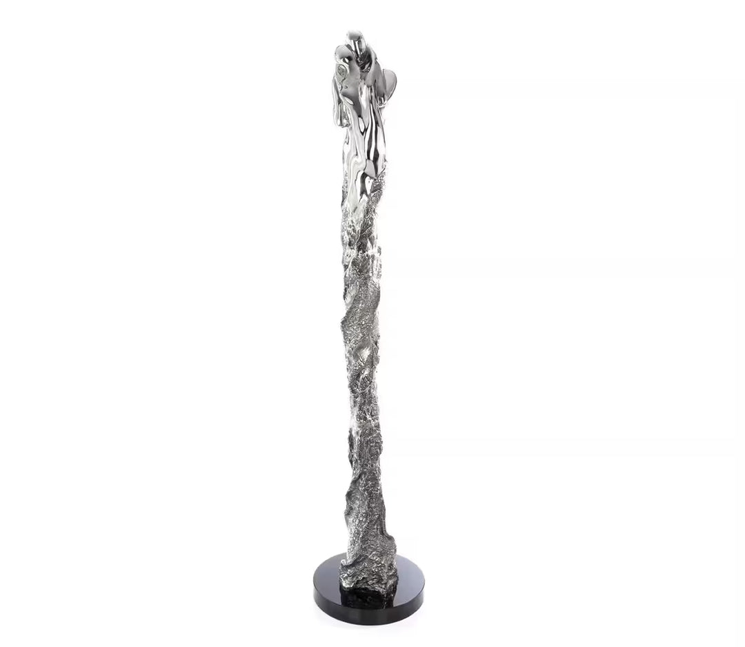 A Jennine Parker limited edition sculpture of two people merged together, the title is Intertwined I