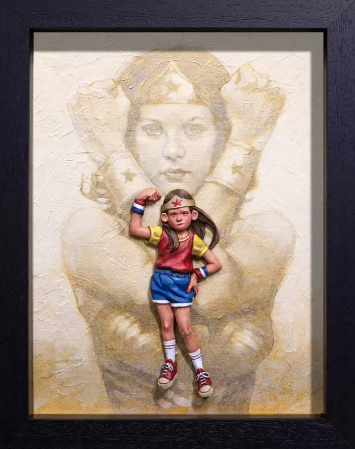 A Craig Davison limited edition of a little girl dressed like Wonder Woman with Wonder Woman behind her, the title is It&