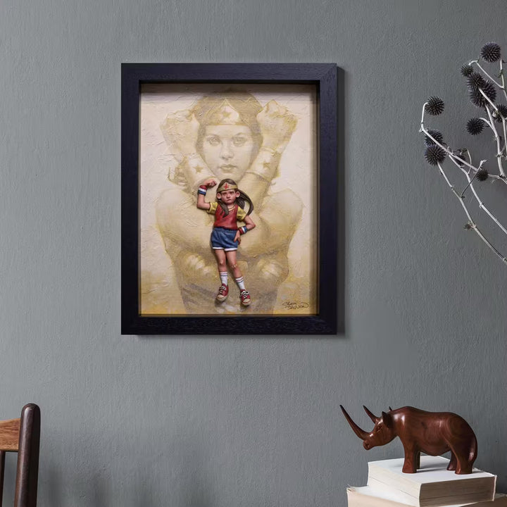 A Craig Davison limited edition of a little girl dressed like Wonder Woman with Wonder Woman behind her, the title is It&
