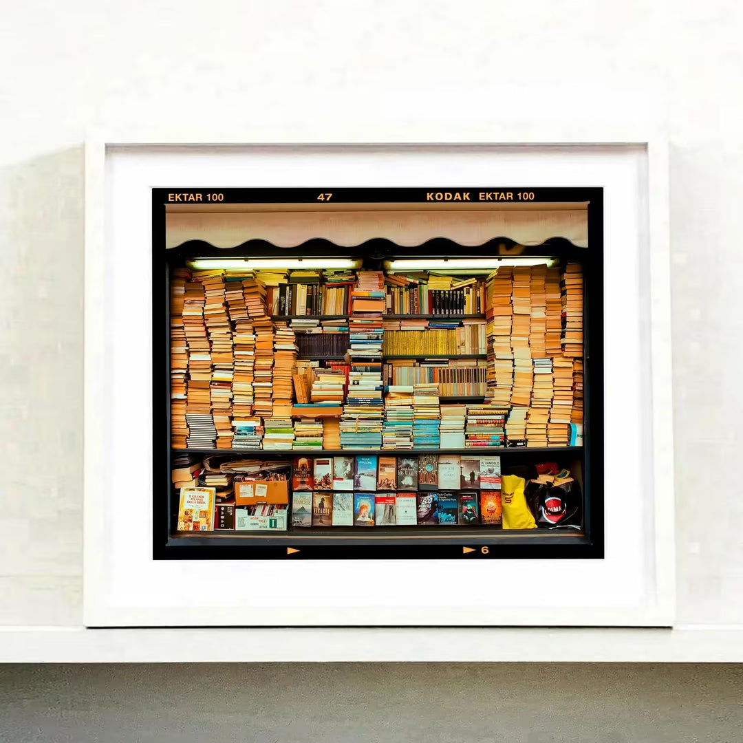 A white framed limited edition photograph by Richard Heeps using vibrant colours, the title is Karma, Milan, 2018