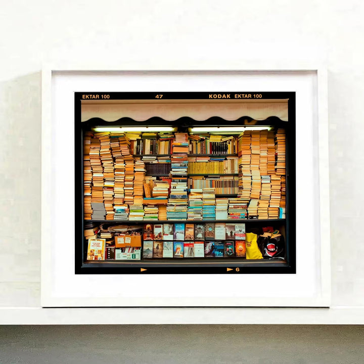 A white framed limited edition photograph by Richard Heeps using vibrant colours, the title is Karma, Milan, 2018