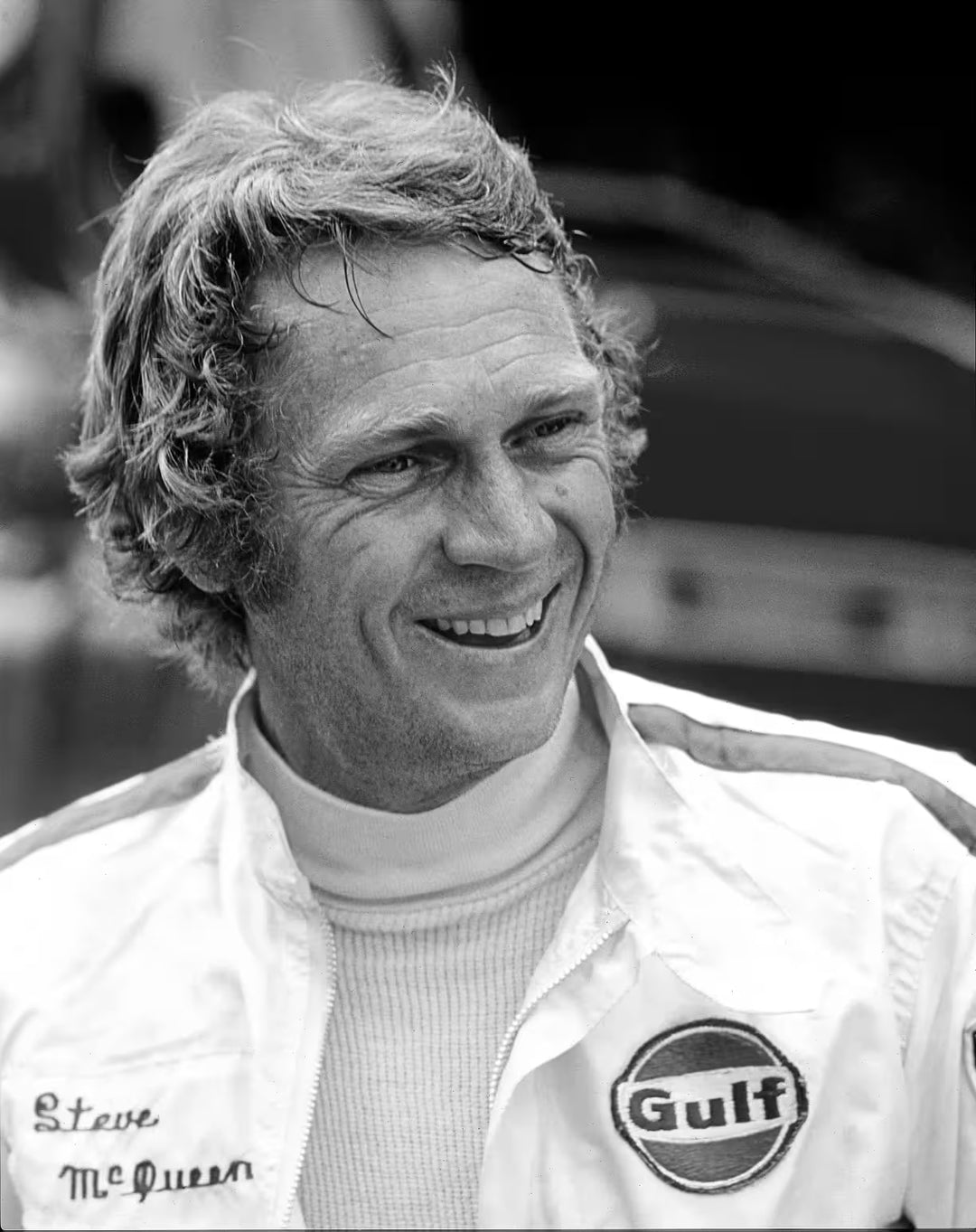 A limited edition by Anwar Hussain of Steve McQueen, the title is Le Mans France Steve McQueen Smiling