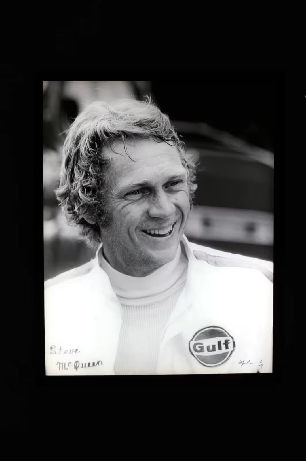 A limited edition by Anwar Hussain of Steve McQueen, the title is Le Mans France Steve McQueen Smiling