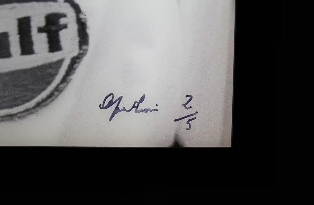 A limited edition by Anwar Hussain of Steve McQueen, the title is Le Mans France Steve McQueen Smiling