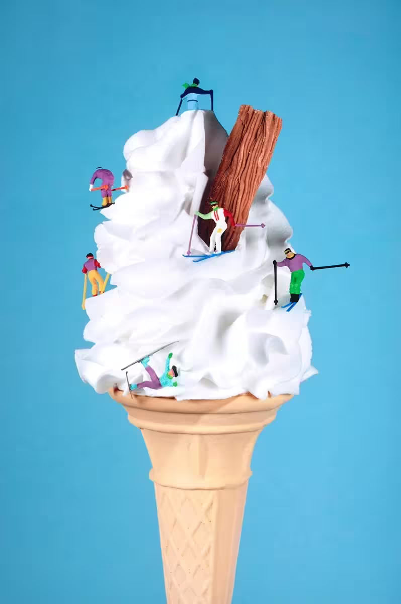A Mr Kuu limited edition piece of a ice cream cone with people skiing down it, the title is Let&