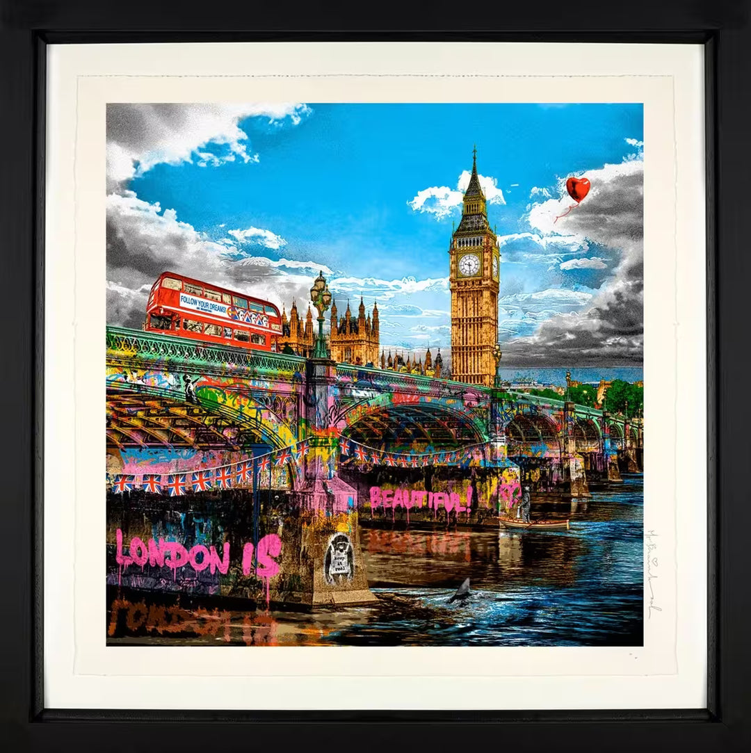 A Mr Brainwash framed limited edition of the houses of parliament viewed from underneath a spray painted bridge with a red double decker bus going over the bridge, the title is London Is Beautiful
