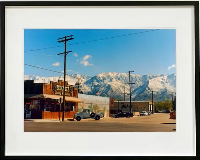 A framed limited edition photograph by Richard Heeps using vibrant colours, the title is Lone Pine, California, 2000