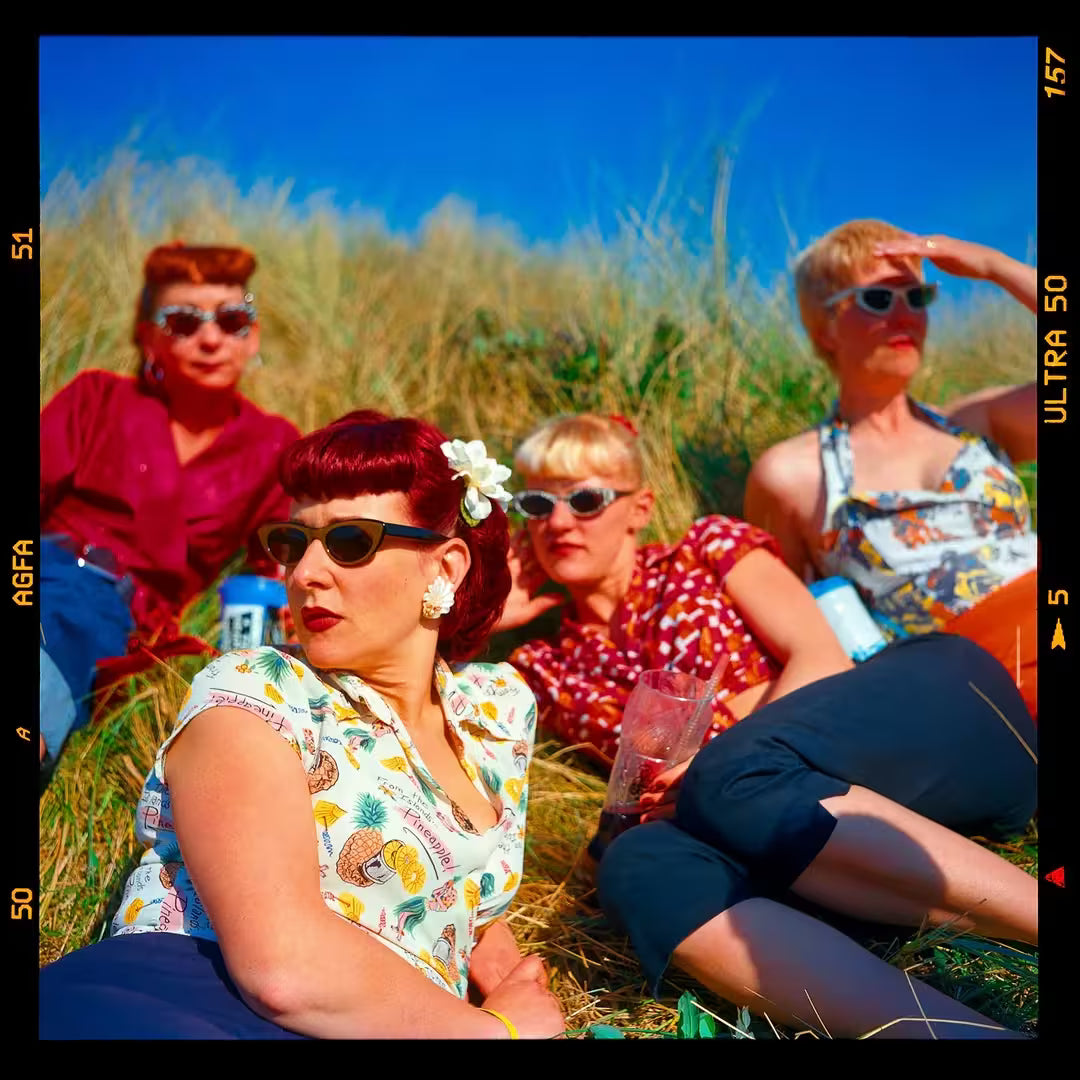 A limited edition photograph by Richard Heeps using vibrant colours, the title is Lynn, Lisa, Charlotte & Theresa, Hemsby, Norfolk, 2001