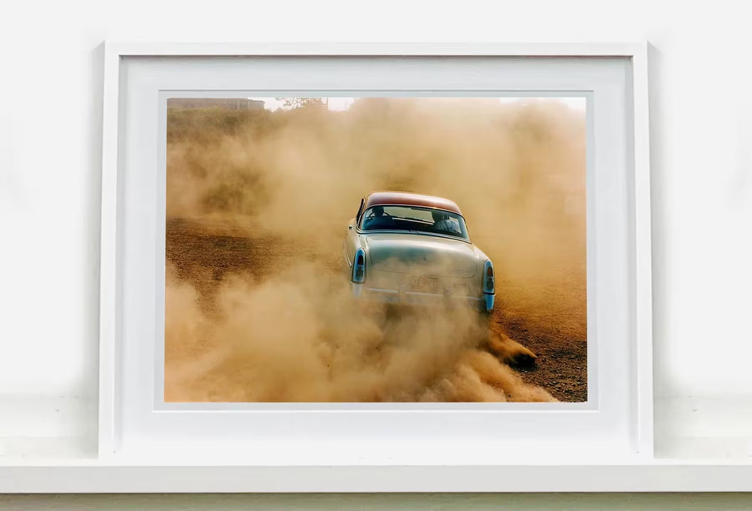A white framed limited edition photograph by Richard Heeps using vibrant colours, the title is Mercury In The Dust, Hemsby, Norfolk, 2000