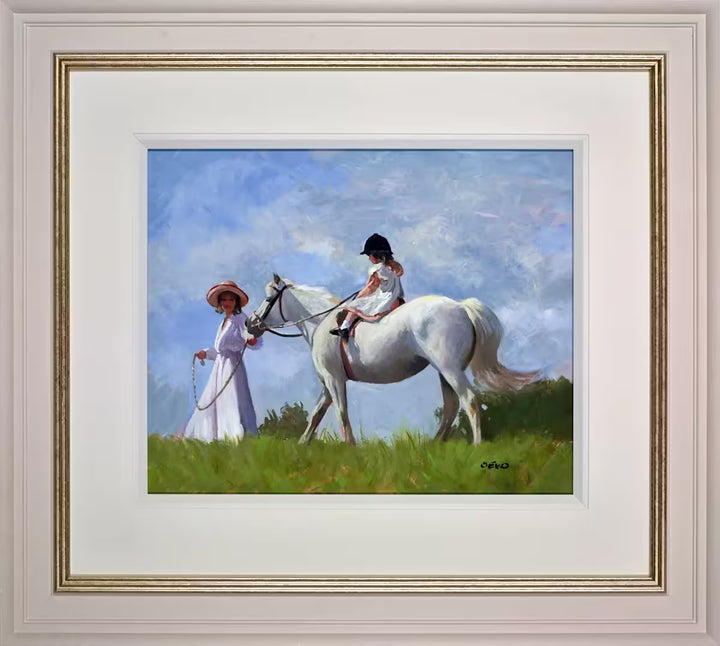 A Sherree Valentine Daines framed original of a lady guiding a white horse with a child sat on it, the title is My First Pony Ride