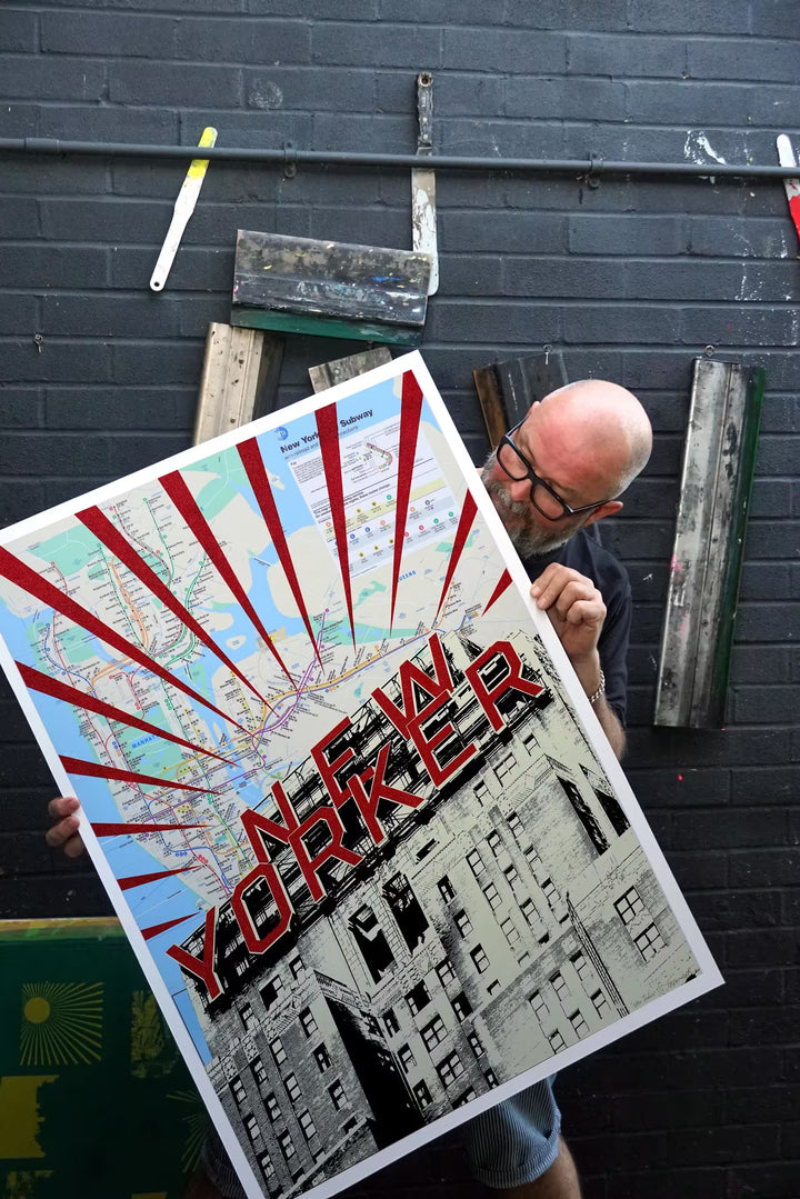Jayson Lilley holding New Yorker