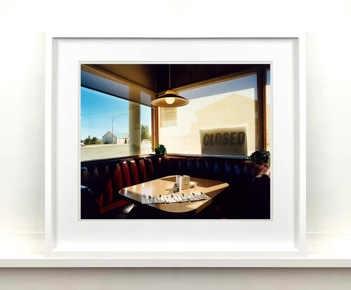 A white framed limited edition photograph by Richard Heeps using vibrant colours, the title is Nicely&