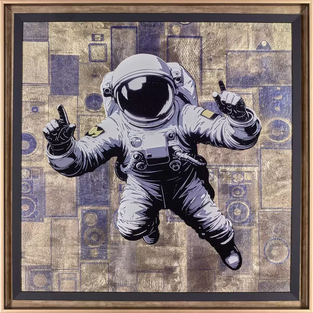 A Maxim framed limited edition of an astronaut floating against a pattern, the title is No Limits