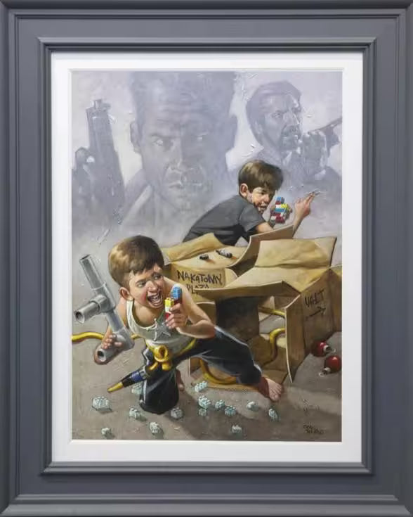 A Craig Davison limited edition piece of two boys pretending to sneak around each other on walkie talkies, the title is Now I Have A Machine Gun, Ho Ho Ho
