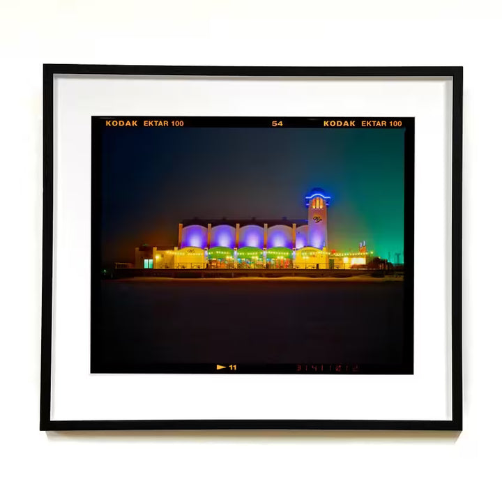 A framed limited edition photograph by Richard Heeps using vibrant colours, the title is Ocean View, Great Yarmouth, Norfolk, 2024