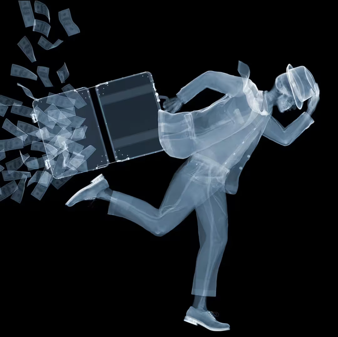 A limited edition Chromaluxe print by Nick Veasey of an X-Rayed businessman running with money falling out of their bag, the title is On The Run