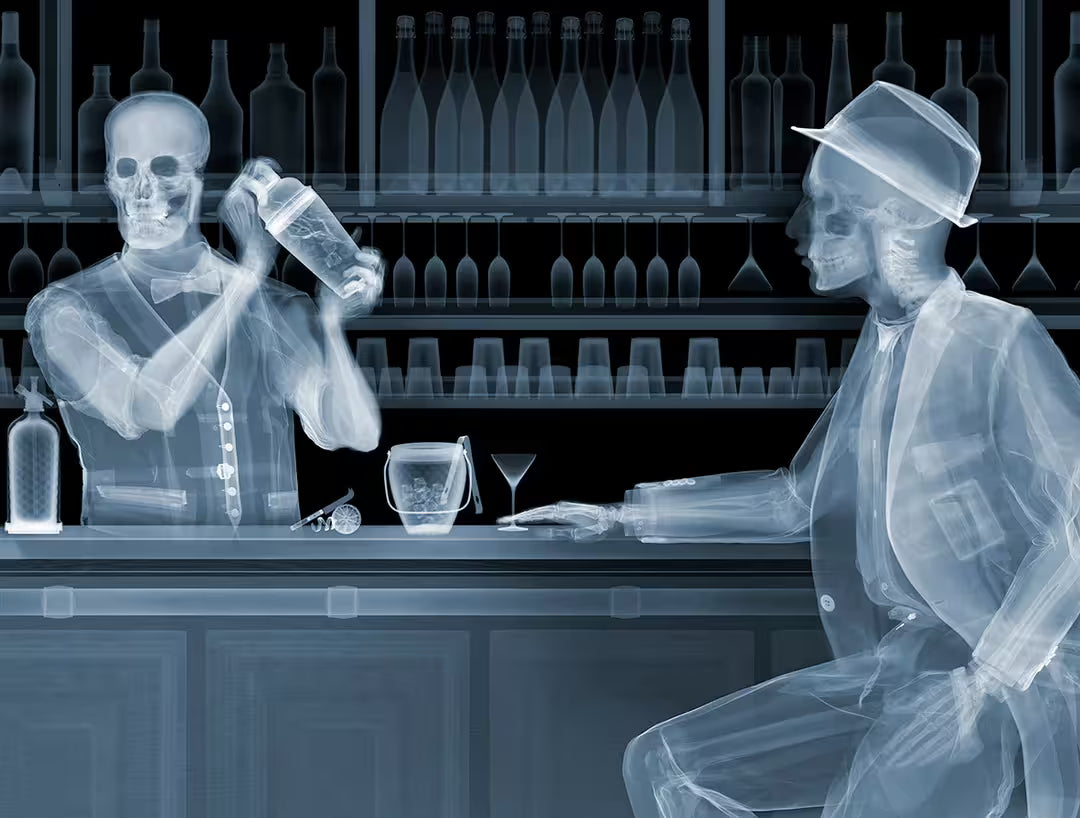 A Nick Veasey limited edition Chromaluxe Xray of a person behind a bar shaking a drink and a person sat in front waiting for a drink, the title is One For The Road