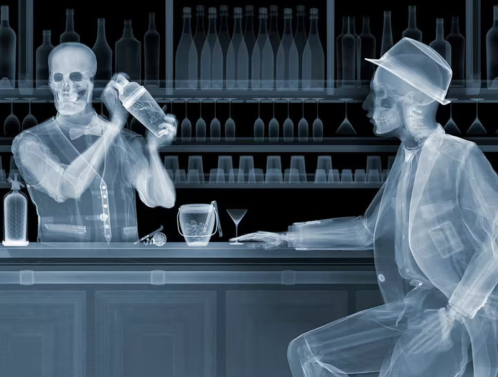 A Nick Veasey limited edition Chromaluxe Xray of a person behind a bar shaking a drink and a person sat in front waiting for a drink, the title is One For The Road