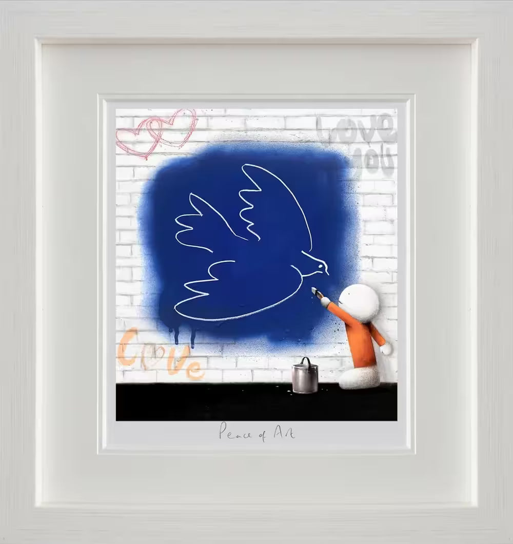 A Doug Hyde framed limited edition of a person in orange painting a white dove on a wall that has been spray painted blue, the title is Peace of Art