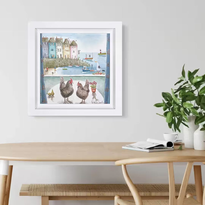 A Rebecca Lardner limited edition of a seaside town viewed from a window with two chickens on a table, the title is Pecking Order