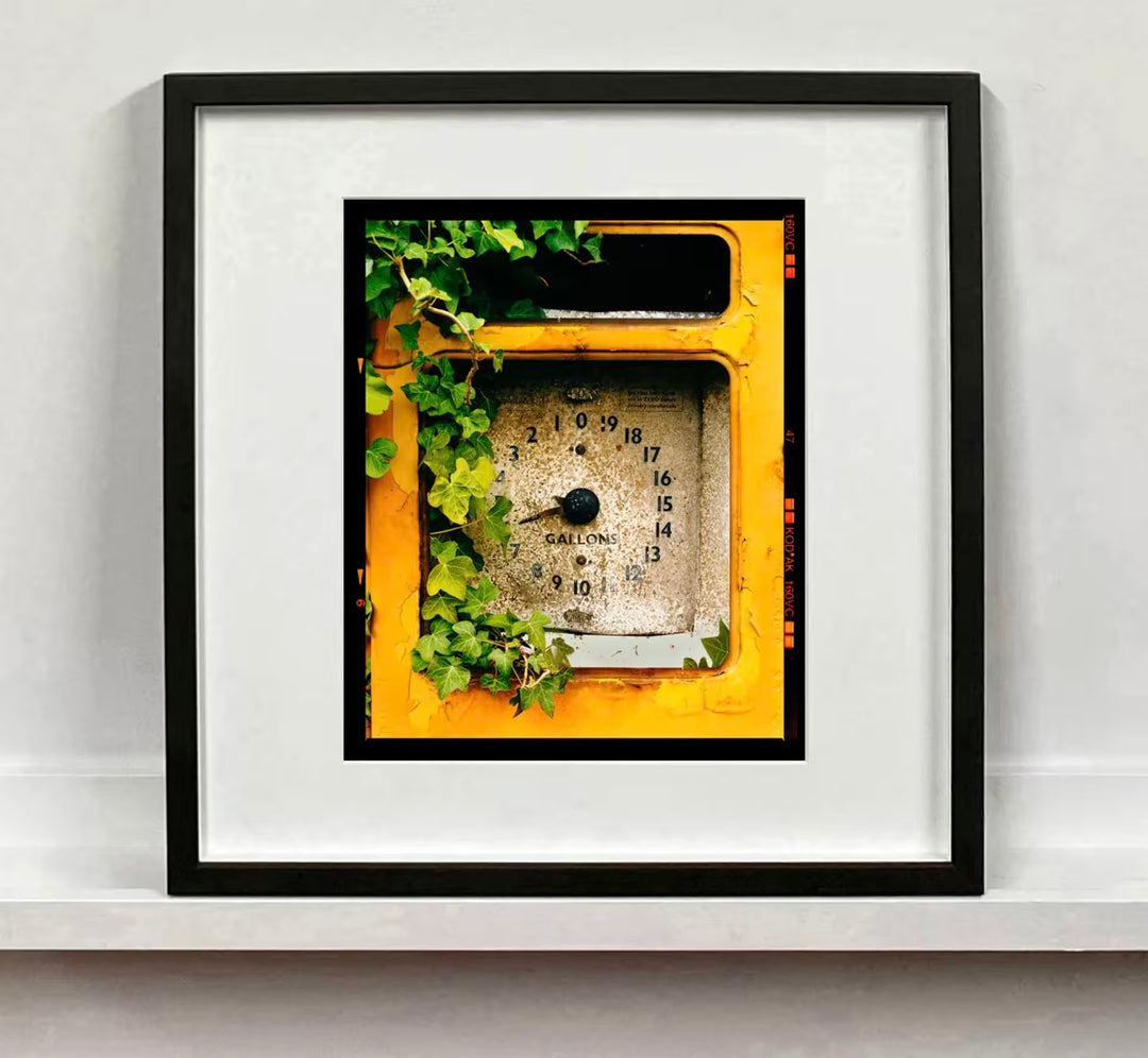 A framed limited edition photograph by Richard Heeps using vibrant colours, the title is Petrol Pump, Stow Bardolph, Norfolk, 2005