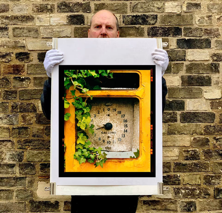 Richard Heeps holding Petrol Pump, Stow Bardolph, Norfolk, 2005