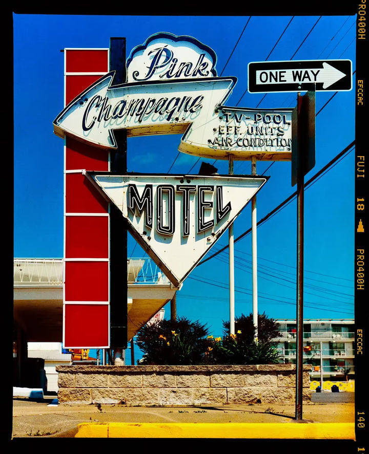 A limited edition photograph by Richard Heeps using vibrant colours, the title is Pink Champagne Motel (Film Rebate), Wildwood Jersey, 2013