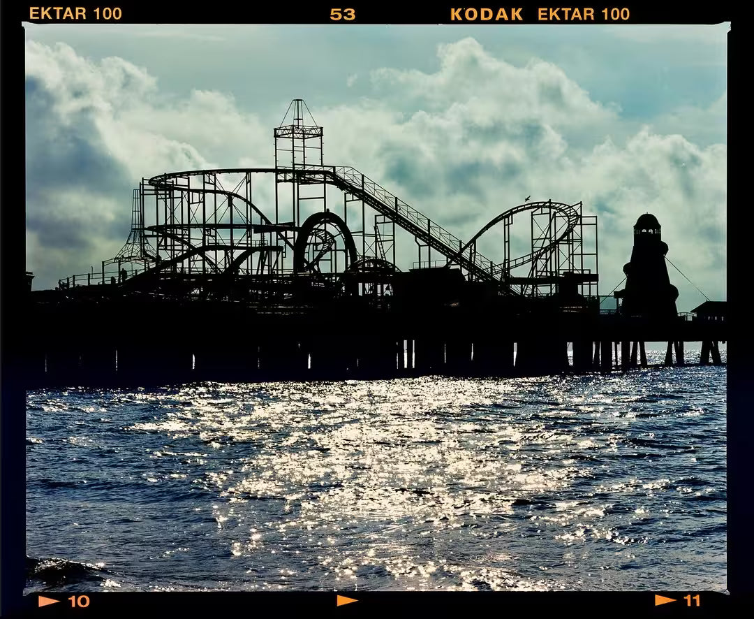 A limited edition photograph by Richard Heeps using vibrant colours, the title is Pleasure Pier, Clacton-On-Sea, 2021