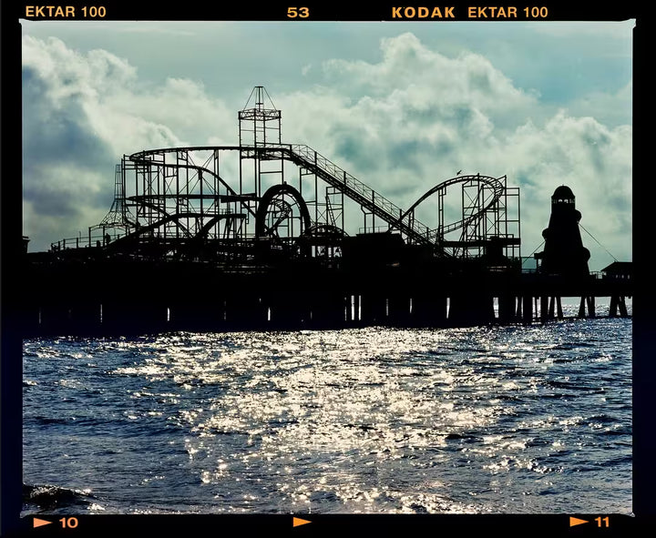 A limited edition photograph by Richard Heeps using vibrant colours, the title is Pleasure Pier, Clacton-On-Sea, 2021