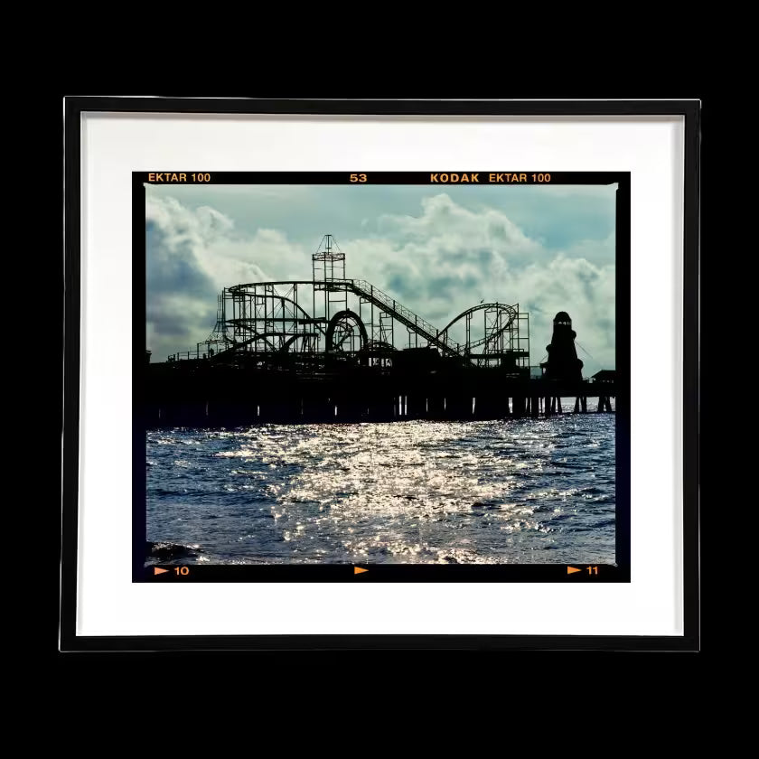 A framed limited edition photograph by Richard Heeps using vibrant colours, the title is Pleasure Pier, Clacton-On-Sea, 2021