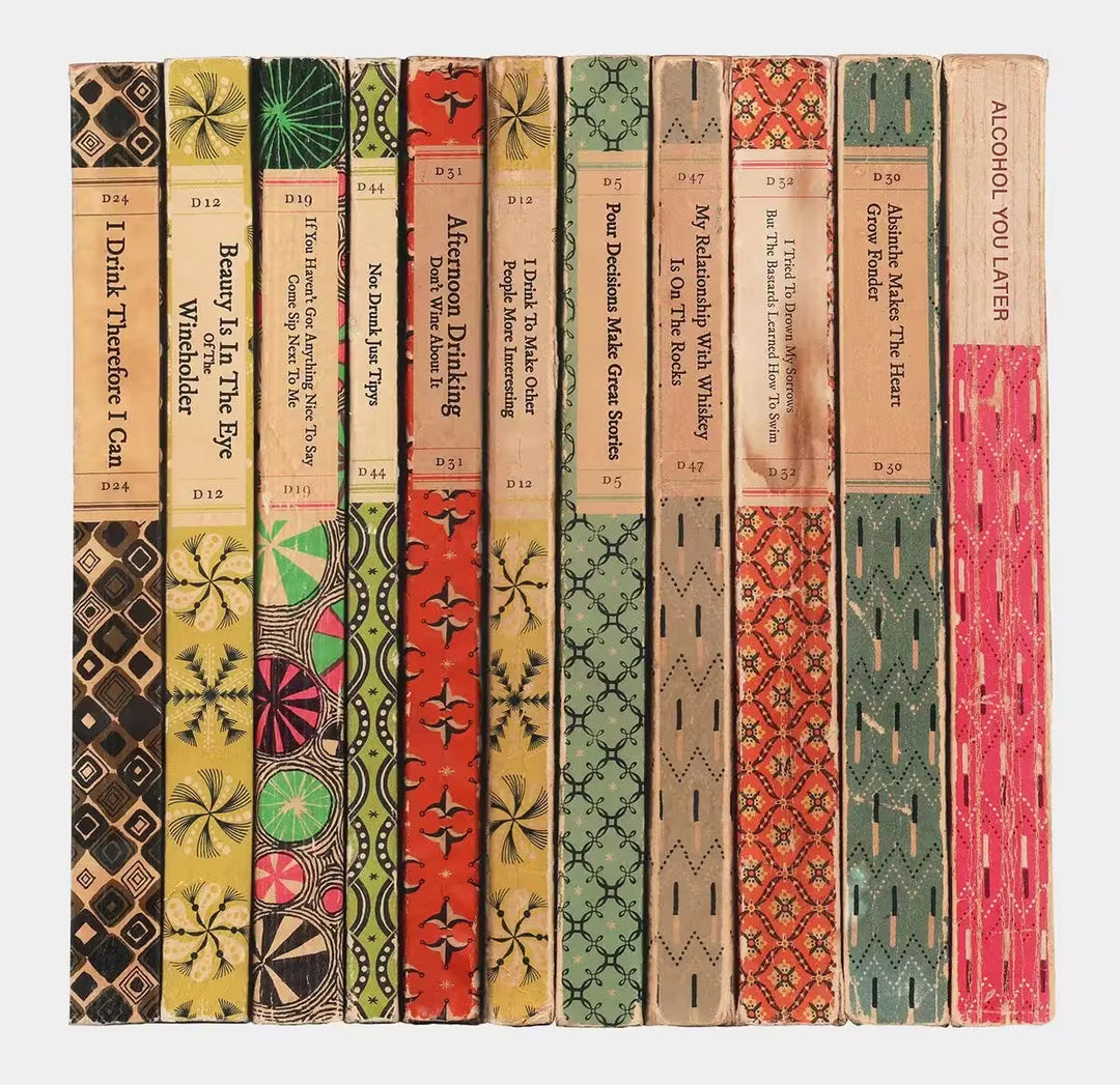 A limited edition by The Connor Brothers of a stack of books with witty book titles, the title is Pour Decisions