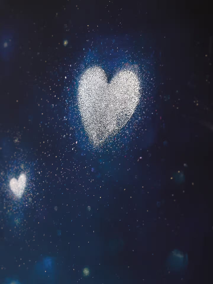 A Doug Hyde limited edition of a person letting go of glowing dust in the shape of a heart, the title is Pure Magic