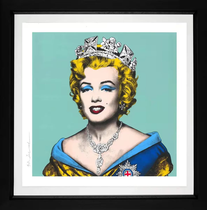 A Mr Brainwash framed limited edition of Marilyn Monroe in the crown jewels against a blue background, the title is Queen Marilyn (Blue)