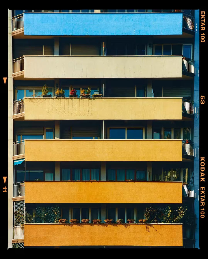 A limited edition photograph by Richard Heeps using vibrant colours, the title is Rainbow Apartments (Film Rebate), Milan, 2020