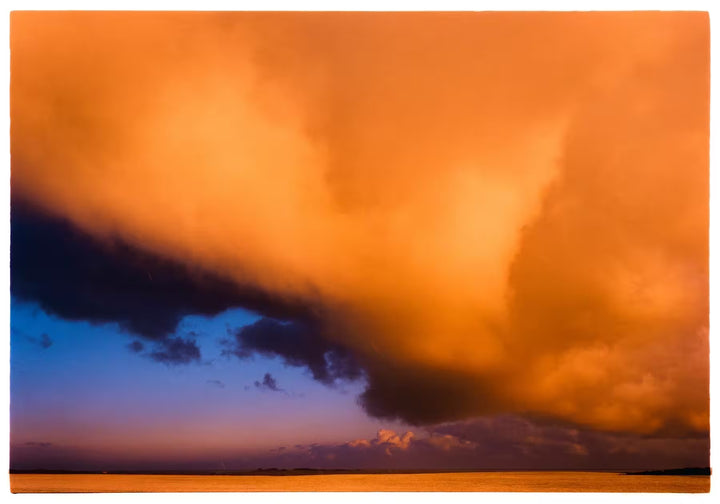 A limited edition photograph by Richard Heeps using vibrant colours, the title is Red Clouds, Wells-Next-The-Sea, Norfolk, 2003
