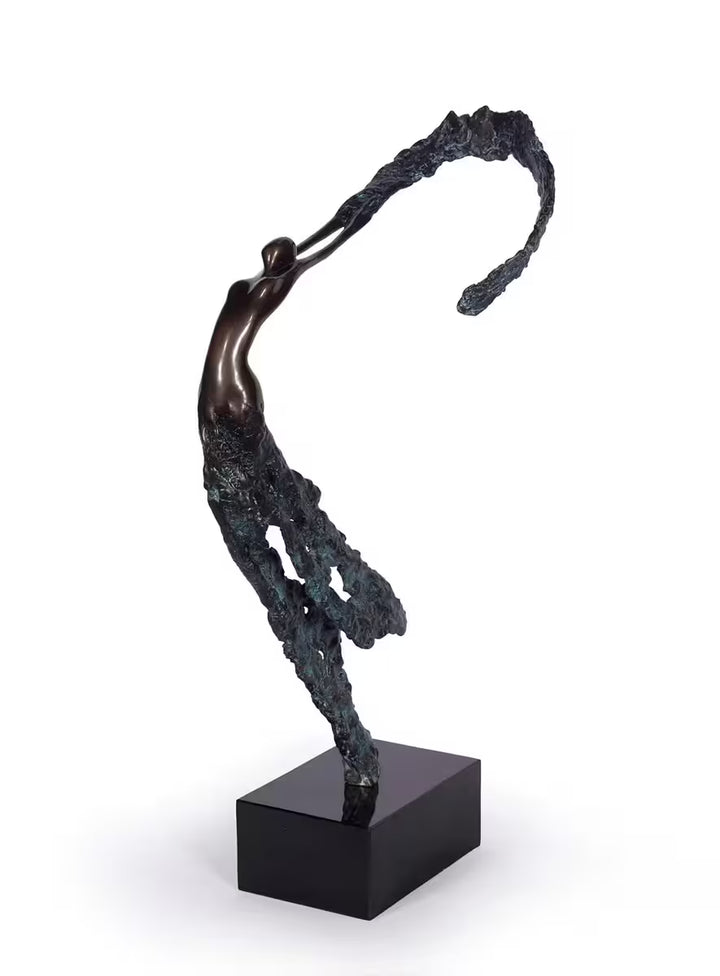 A Jennine Parker limited edition sculpture of a woman dancing, the title is Rhythm of Life