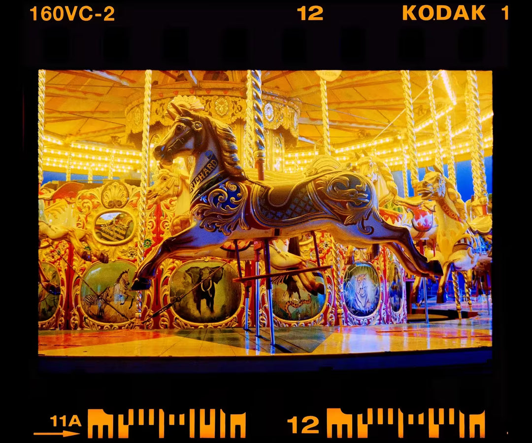 A limited edition photograph by Richard Heeps using vibrant colours, the title is Richard’ Gallopers, Haddenham Steam Rally, Cambridgeshire, 2019